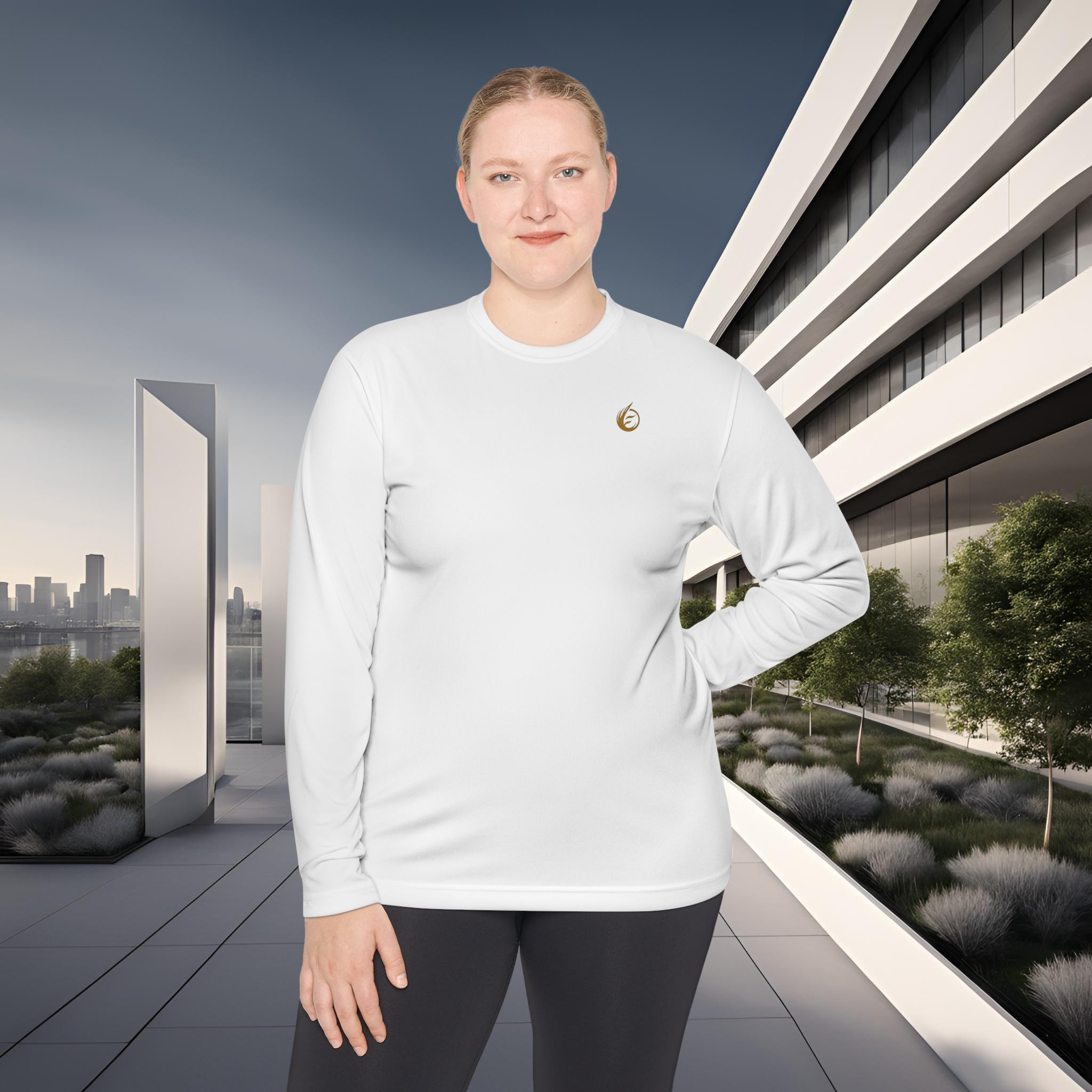 10507094497864972419_2048_customjpeg - Essence Innovation Person standing outdoors in a white long-sleeve shirt, with modern angular building and city skyline in the background.