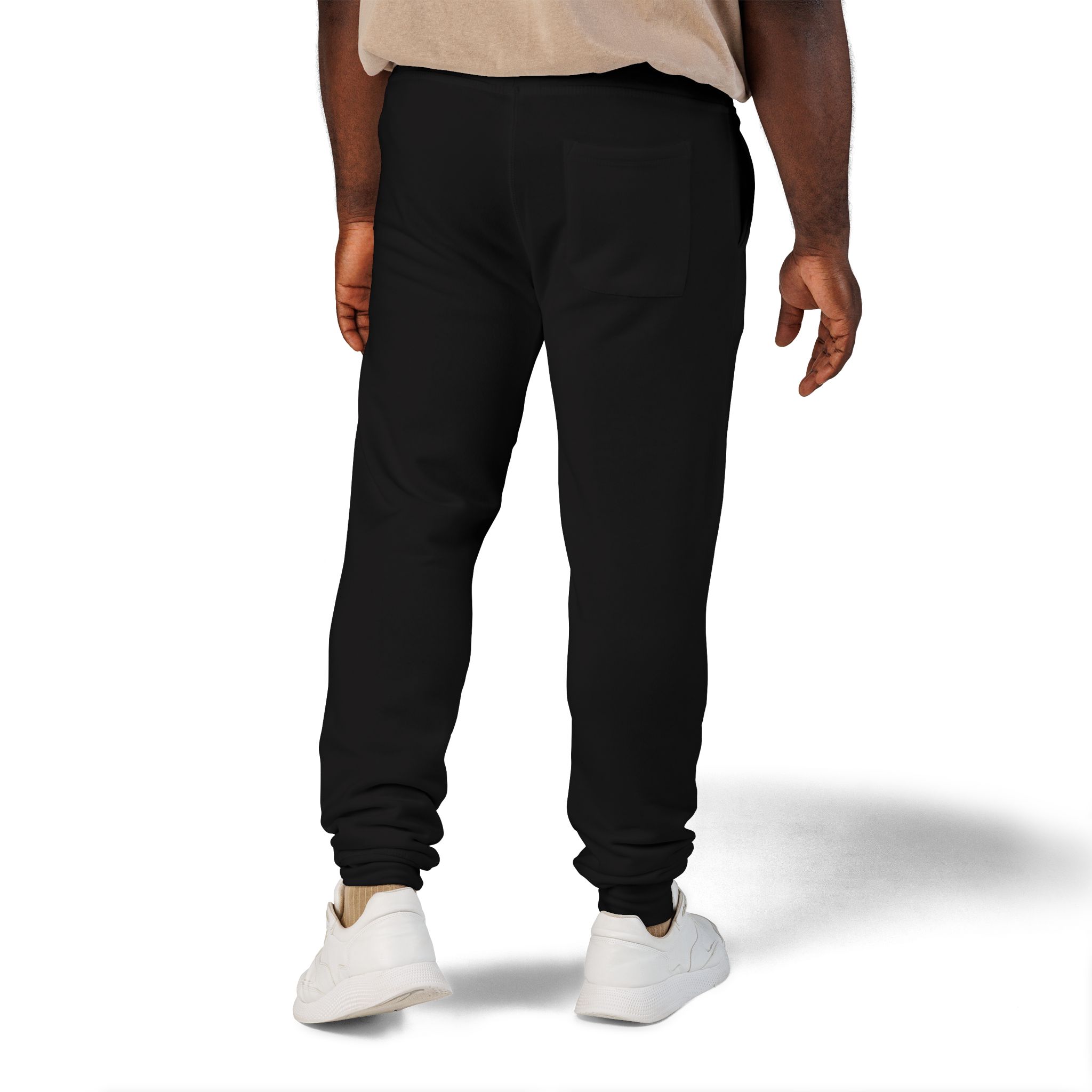 10954163617383708024_2048jpeg - Essence Innovation Back view of a person wearing black pants with a rear pocket, beige top, and white sneakers on a white background with soft shadow.