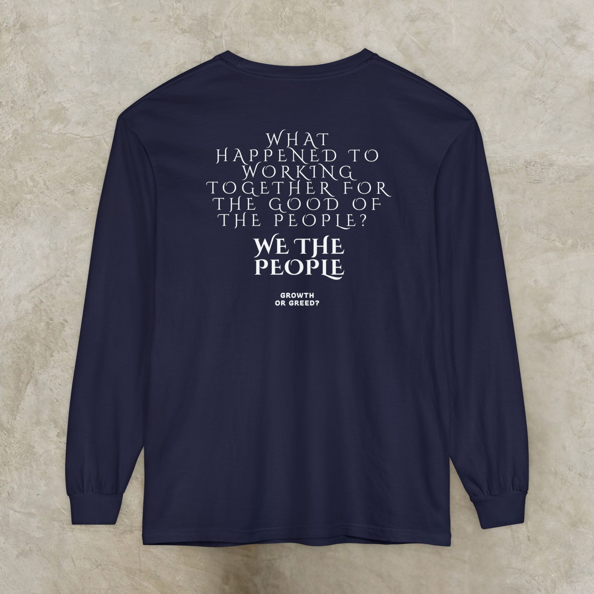 334340691233106121_2048_customjpeg - Essence Innovation Back view of a navy long-sleeve shirt with large white serif text: 'What happened to working together for the good of the people? We the people.'