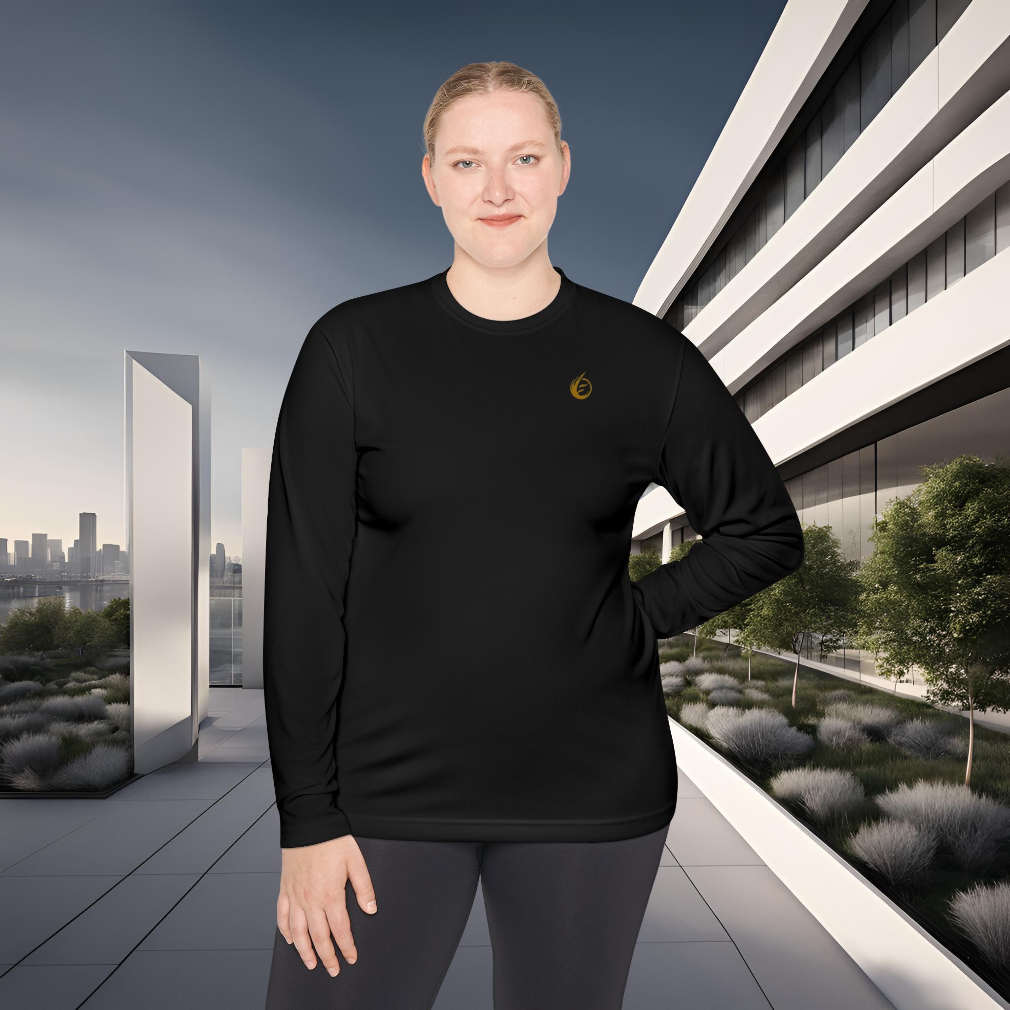 3690250670619014310_2048_customjpeg - Essence Innovation Person wearing a black athletic top standing outdoors with modern white building behind, city skyline in the distance.