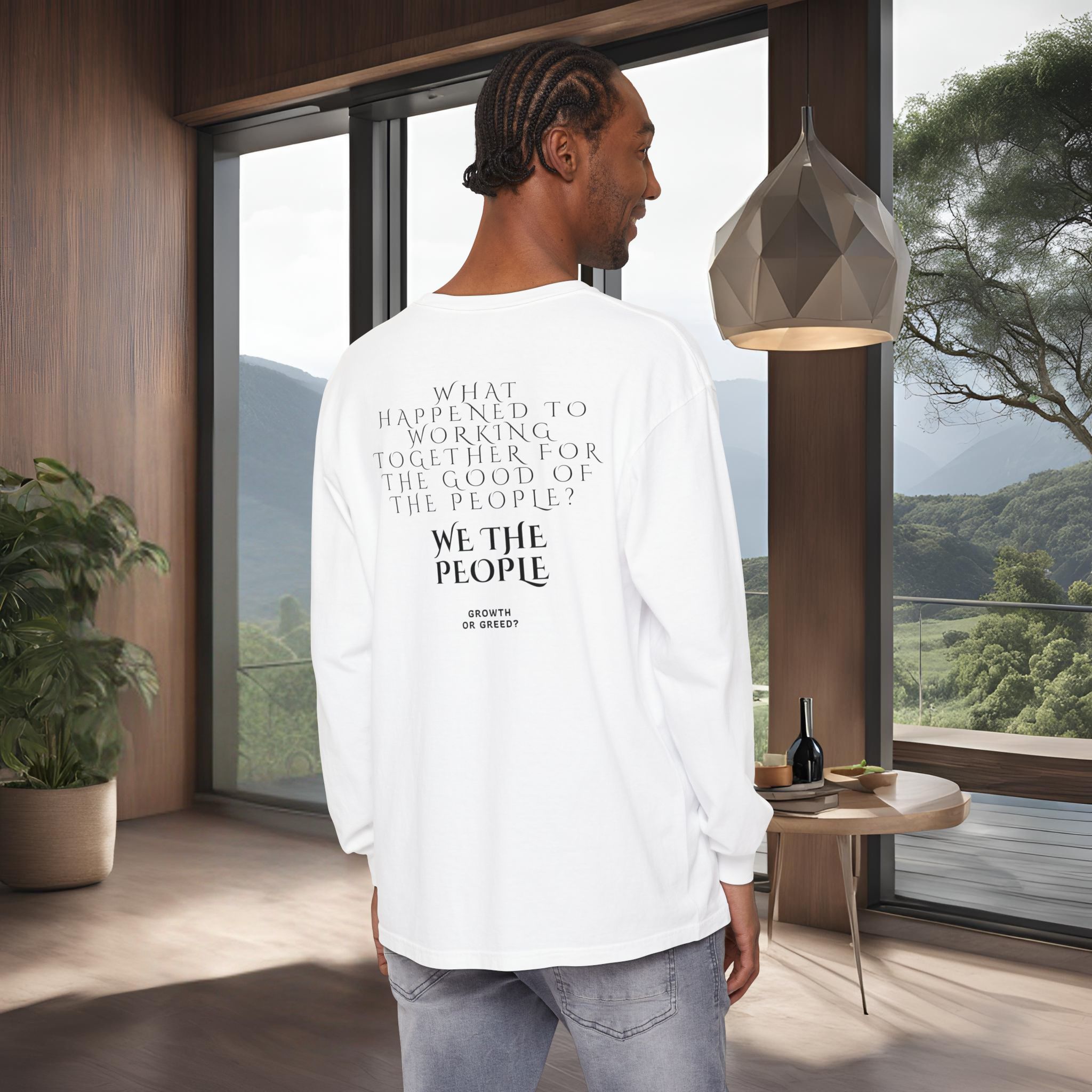 6039431577001798043_2048_customjpeg - Essence Innovation Back view of a person in a white shirt with text on the back, standing inside a modern wooden-walled space with a large window.