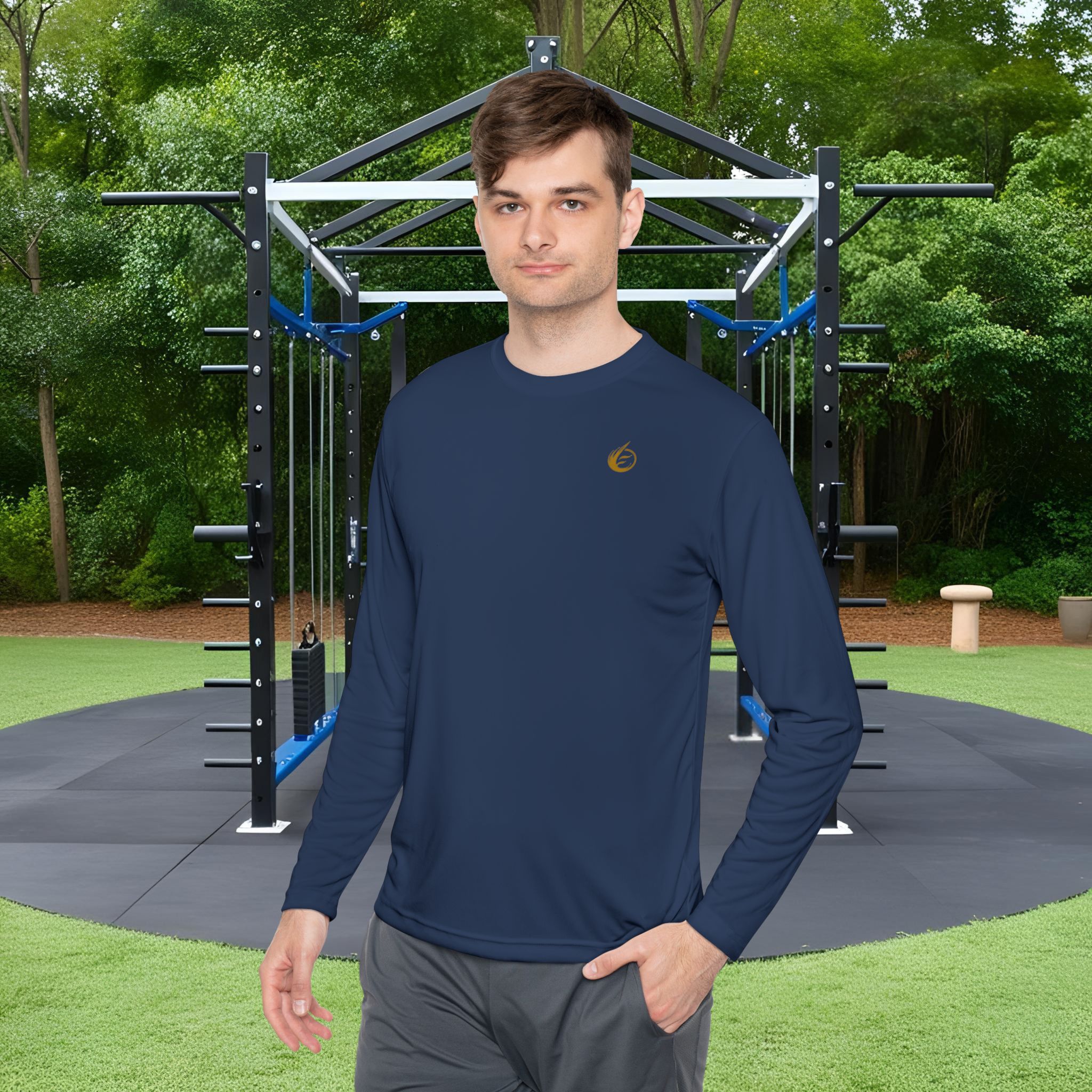7318952273829349952_2048_customjpeg - Essence Innovation Man in a navy athletic shirt stands in front of an outdoor workout rig in a park.