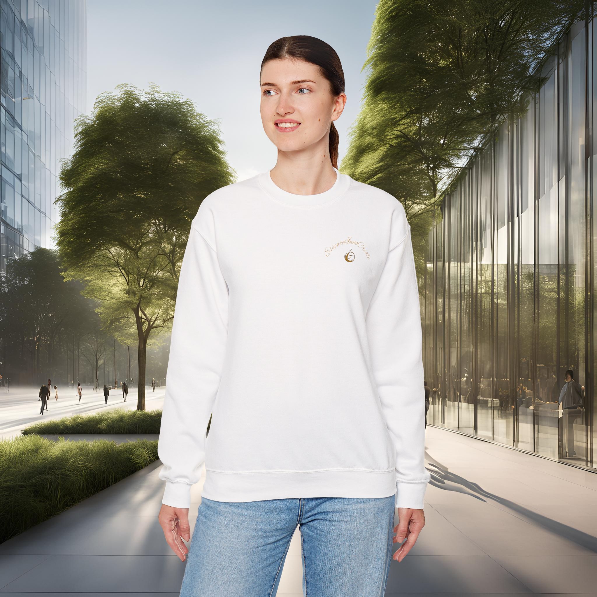7379641445754285714_2048_customjpeg - Essence Innovation Woman wearing a white sweatshirt and blue jeans stands in an urban outdoor plaza with glass buildings and trees in the background.