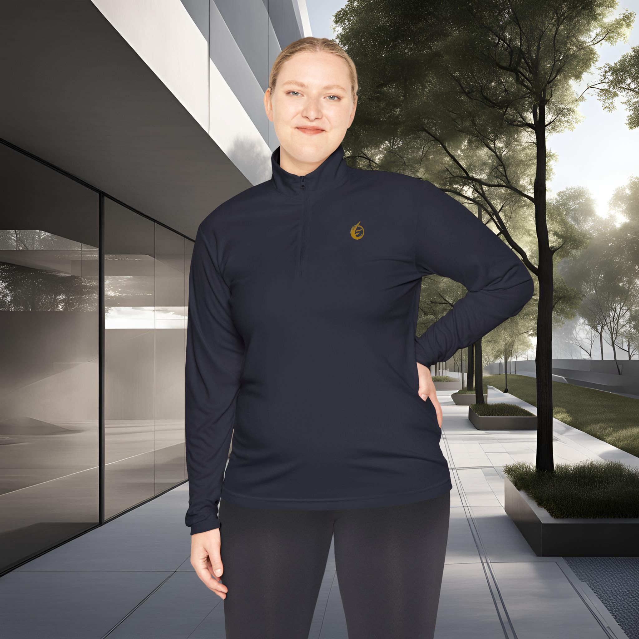 9704179008837564925_2048_customjpeg - Essence Innovation Person wearing a navy athletic jacket stands outdoors in front of a modern glass building with trees in the background.