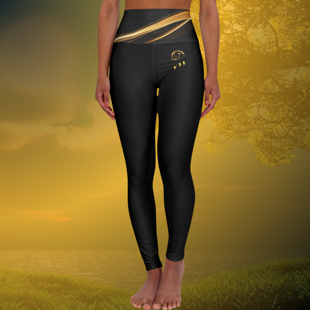 Z21-136 - Essence Innovation Seek More Lower half of a person wearing black athletic leggings with a gold patterned waistband, standing barefoot on a golden background.